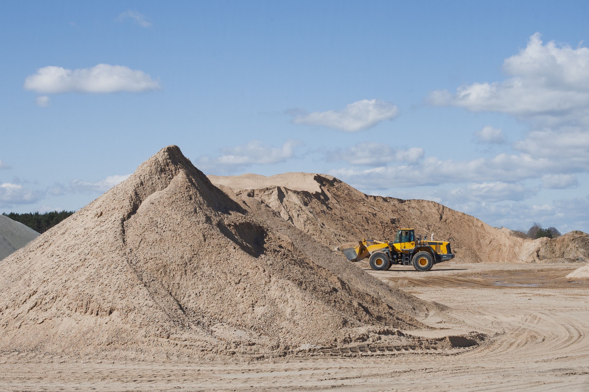 Bulldozer at Sand Quarry on Sunny Day